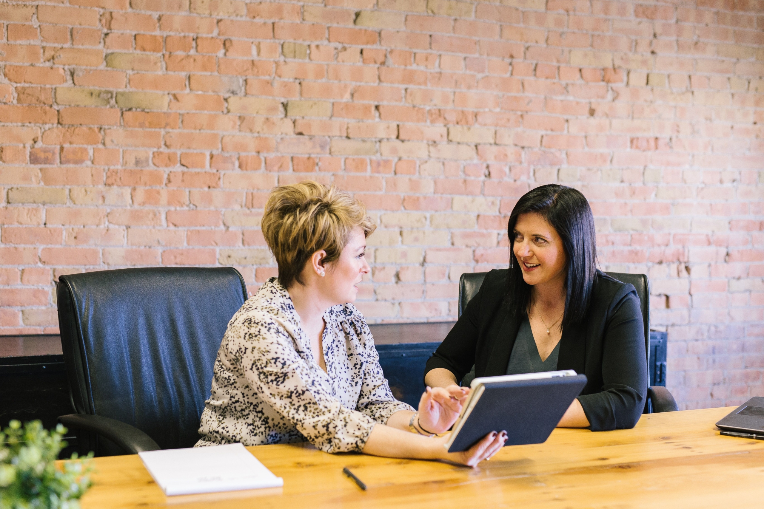Women at conference table in sales interview