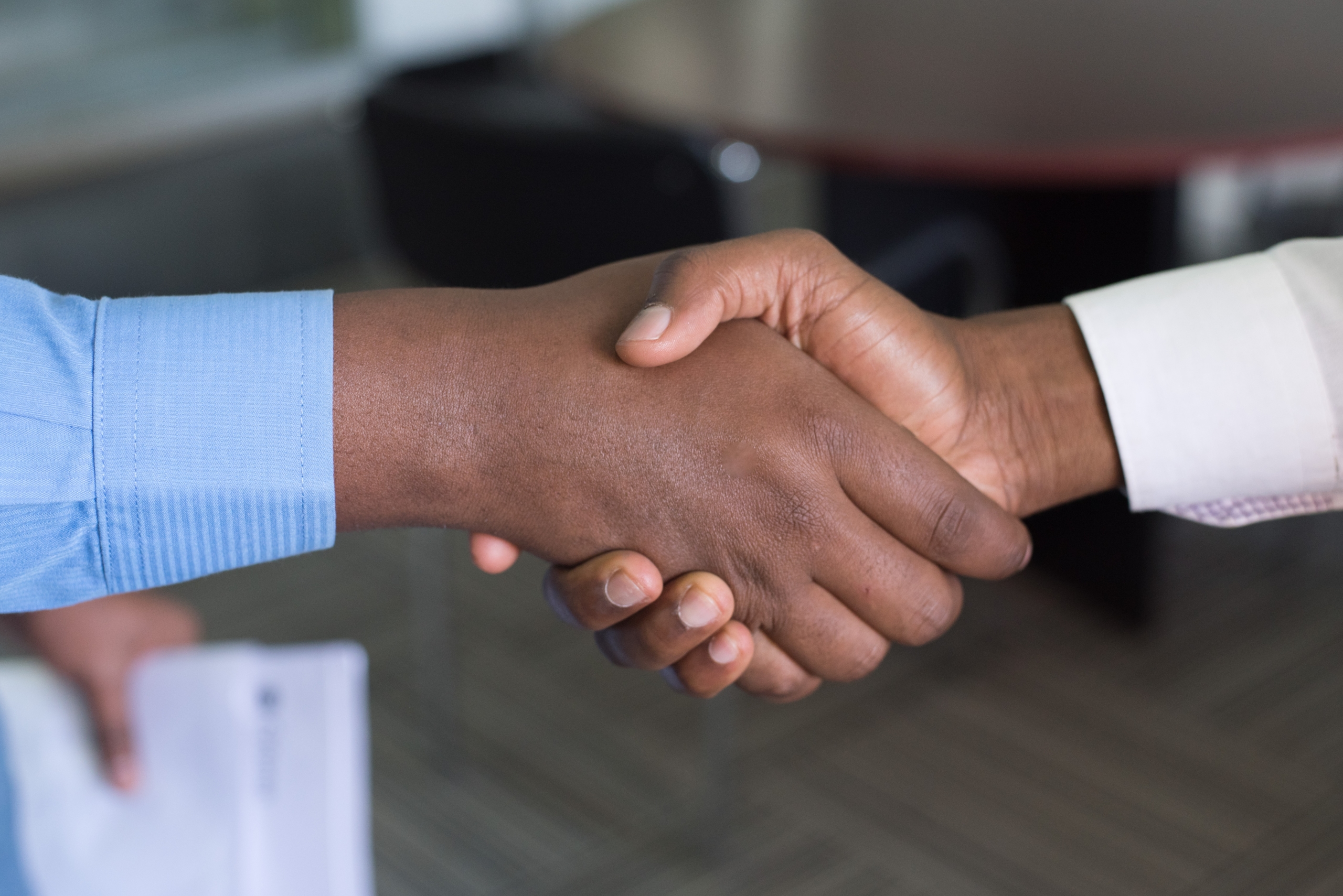 Men shake hands to close sales deal
