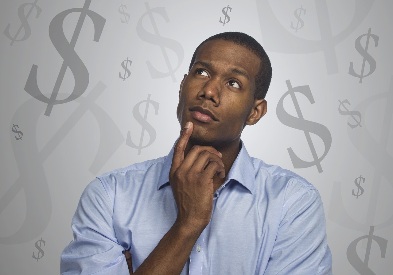 person thinking of SDR salary trends for 2023 with dollar signs